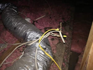 Electrical connection not in a junction box inside the attic.